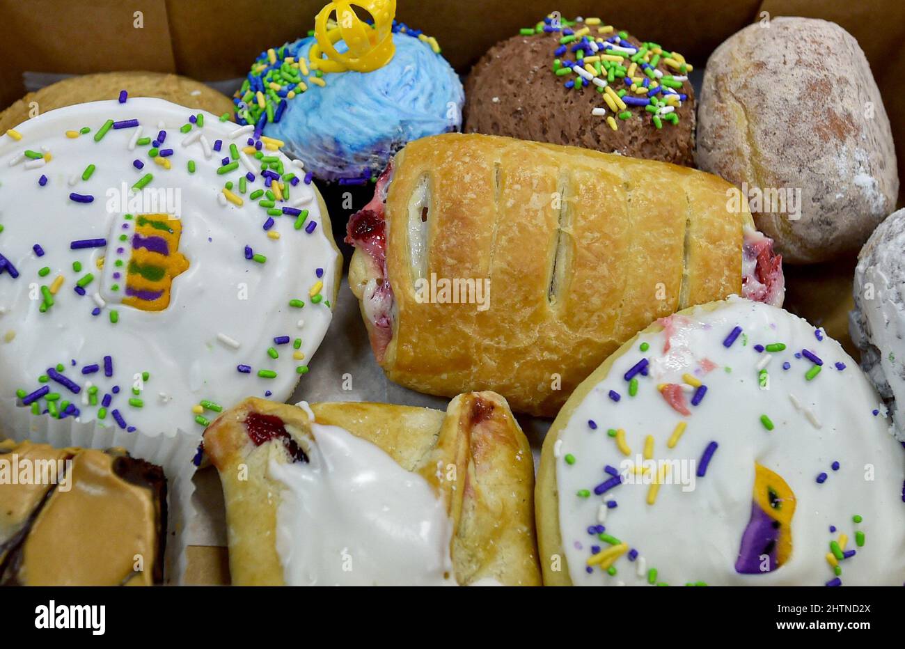 Nanticoke, United States. 01st Mar, 2022. A box of assorted donuts and pastries for Fat Tuesday. Fat Tuesday is celebrated by eating Fastnacht and Paczki, Sanitary Bakery in Nanticoke, Pennsylvania experiences large lines of customers to buy their treats. At noon the bakery was almost sold out of the donuts. Credit: SOPA Images Limited/Alamy Live News Stock Photo