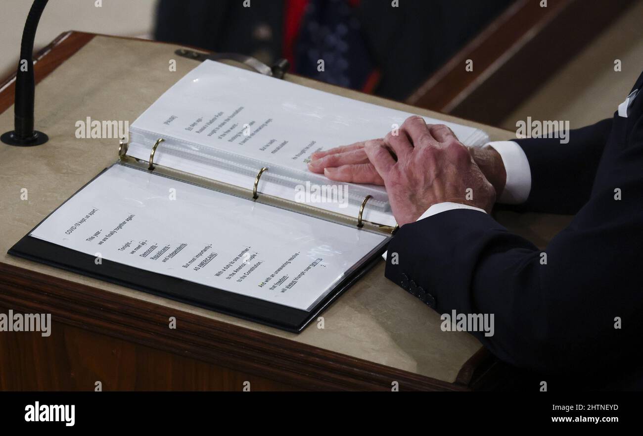 Washington, United States. 01st Mar, 2022. U.S. President Joe Biden rests his hands on the printed copy of his speech as he begins his State of the Union address to a joint session of the U.S. Congress in the House of Representatives Chamber at the Capitol in Washington, DC, March 1, 2022. Pool Photo by Evelyn Hockstein/UPI Credit: UPI/Alamy Live News Stock Photo