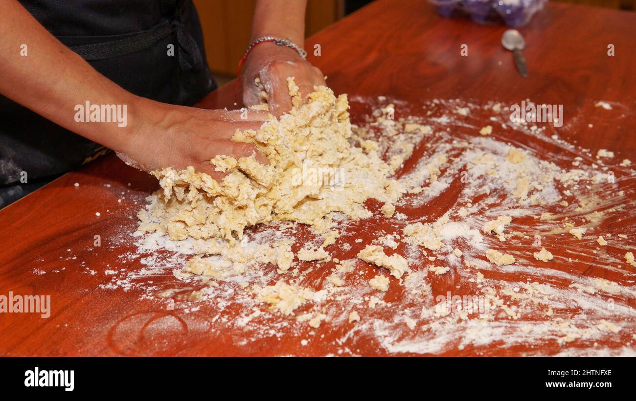 Woman kneading pizza dough in hi-res stock photography and images - Alamy