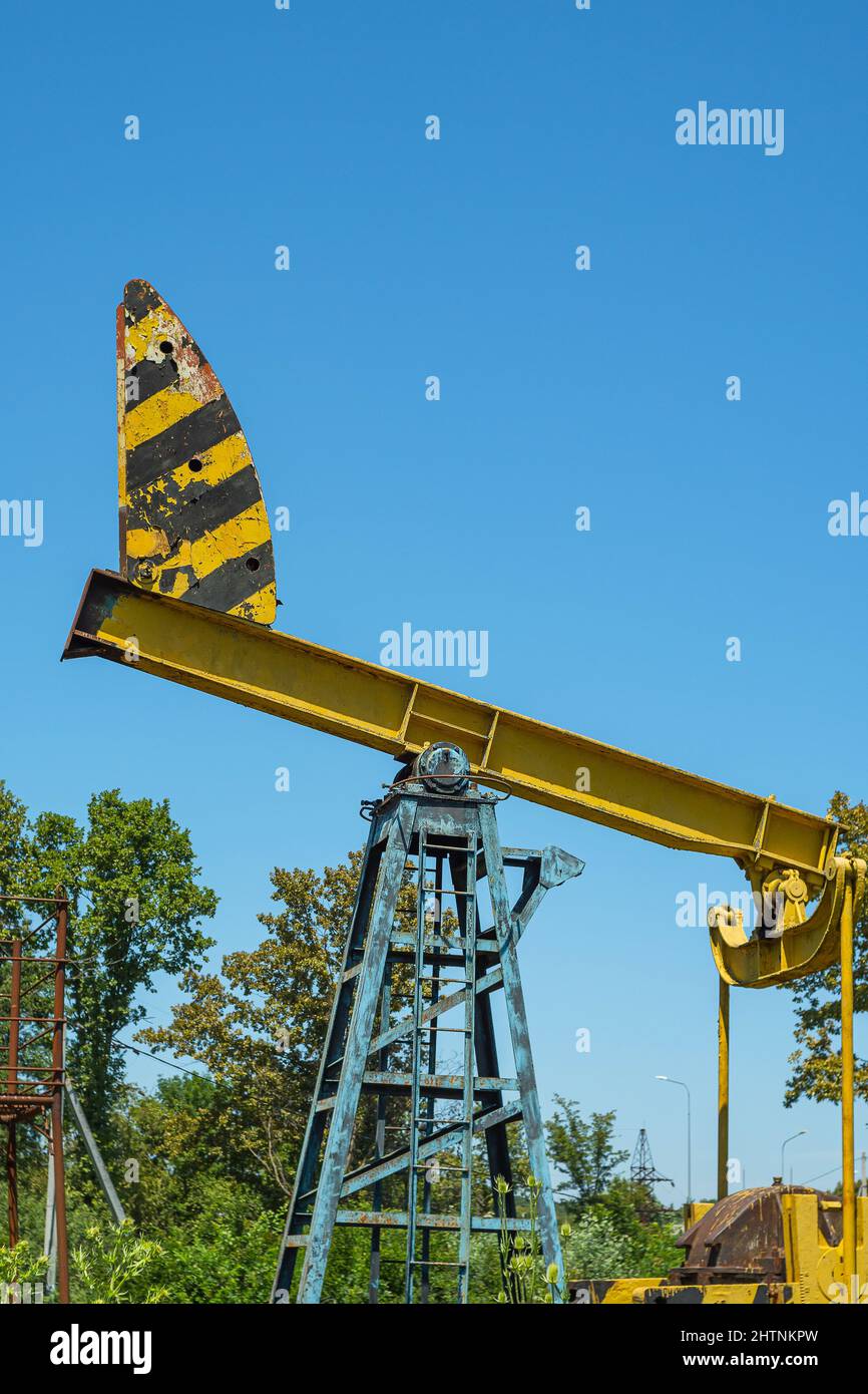 Oil ran out, the oil rig was left to rust in a field. The concept of the decline of the oil