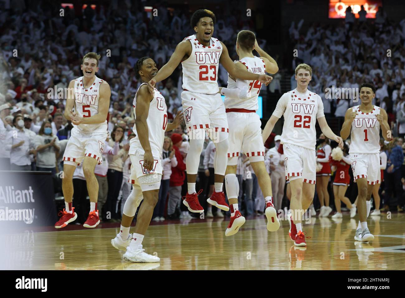 March 1, 20, 2022: Wisconsin Badgers guard Chucky Hepburn (23) celebrates with guard Brad Davison (34), forward Steven Crowl (22), guard Johnny Davis (1), guard Jahcobi Neath (0), and forward Tyler Wahl (5) after making the game winning three pointer during the NCAA Basketball game between the Purdue Boilermakers and the Wisconsin Badgers at the Kohl Center in Madison, WI. Darren Lee/CSM Stock Photo