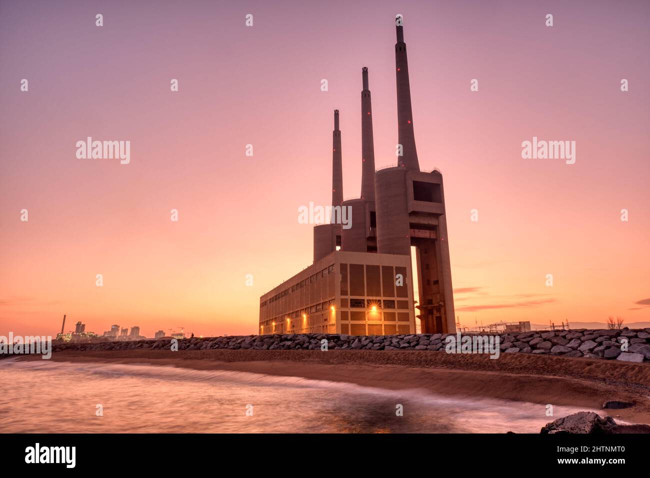 The decommissioned thermal power station at Sant Adria near Barcelona at sunset Stock Photo