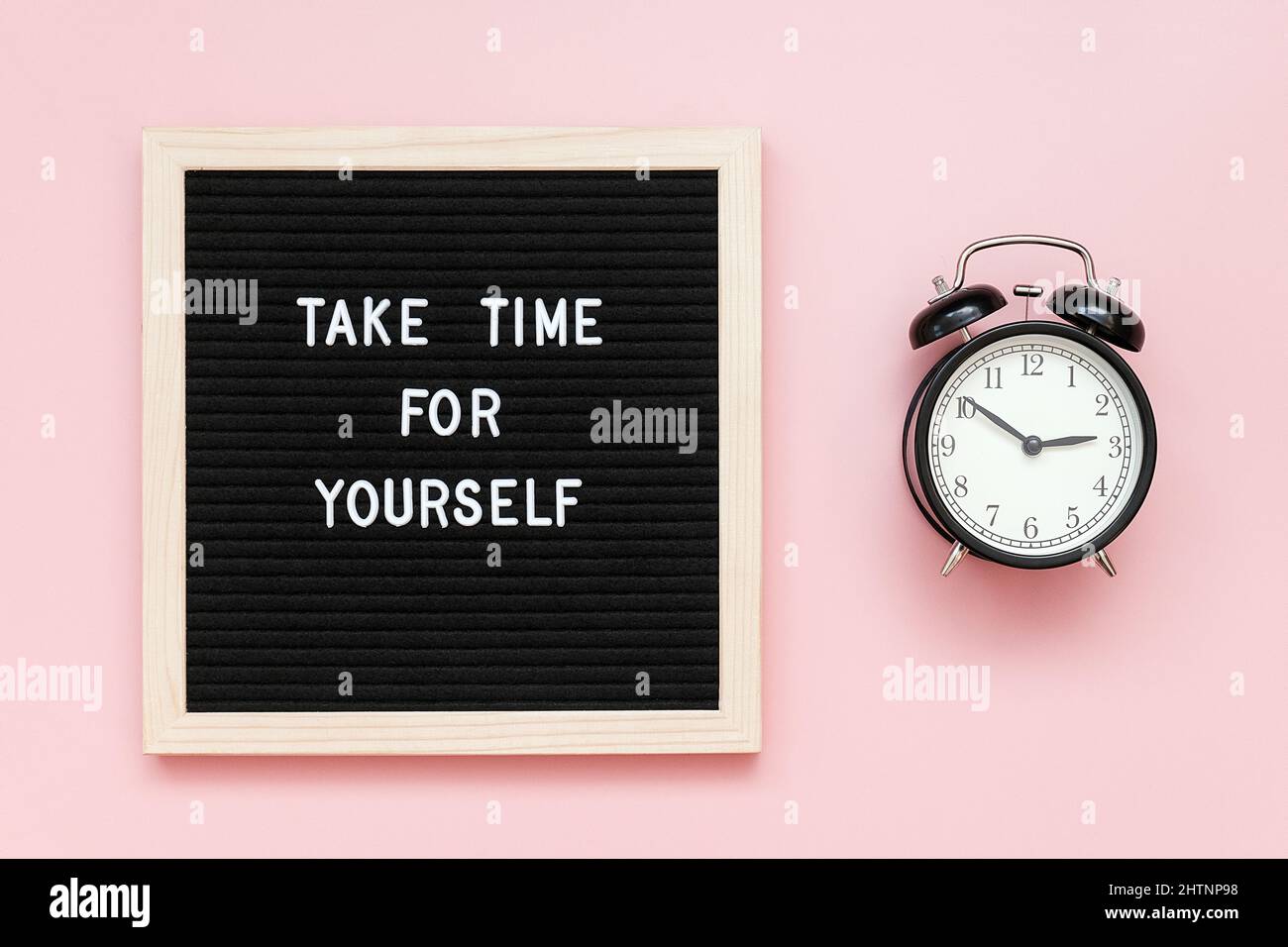 Take time for yourself. Motivational quote on letterboard and black