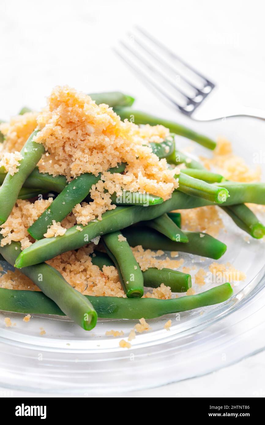green beans served with bread crumbs Stock Photo Alamy