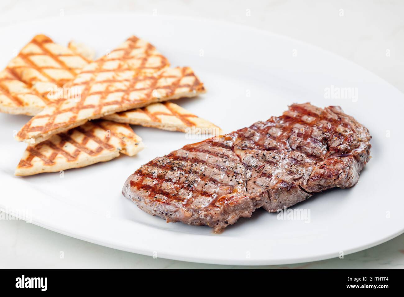 beef steak with grilled pita bread Stock Photo - Alamy