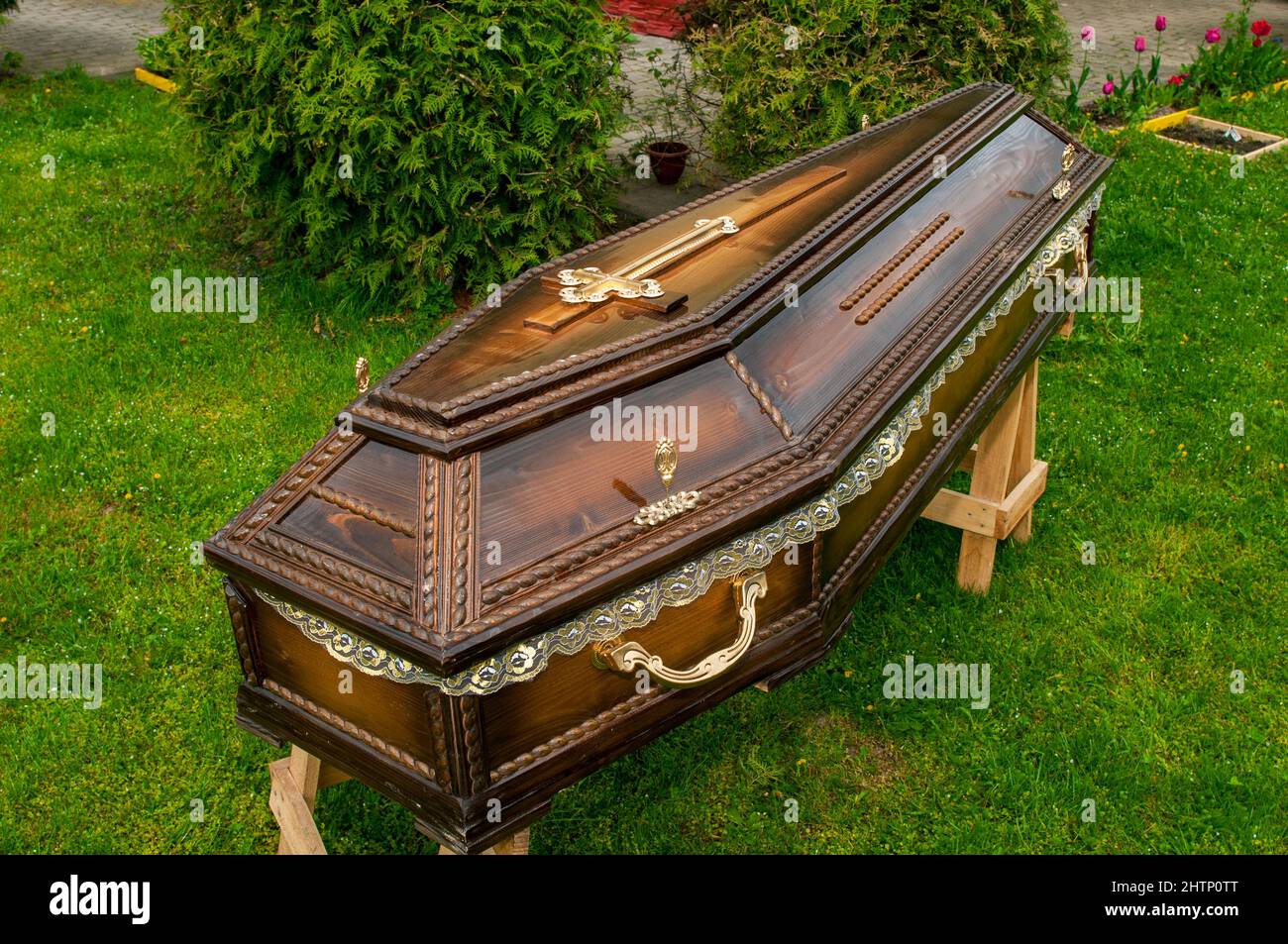 Wooden tomb, cross decoration, ornament, massive handles for burial Stock Photo