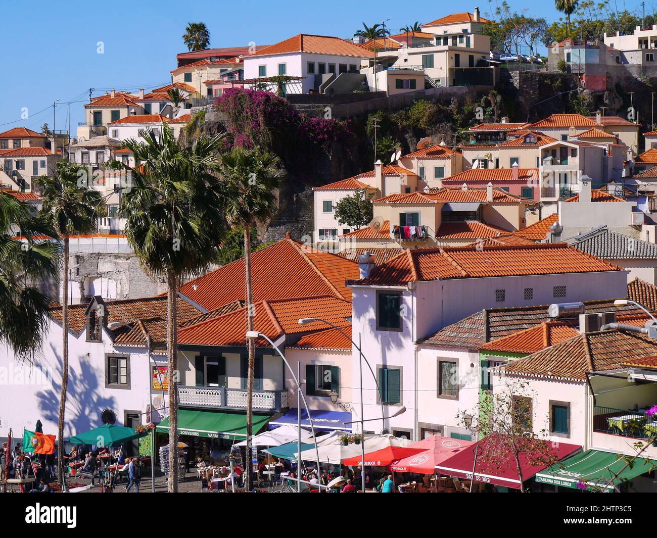 Hillside village near mountains Stock Photo - Alamy