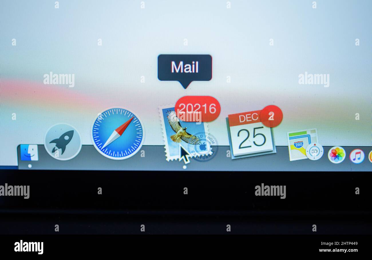 London, United Kingdom - Dec 25, 2018: Icon of Mail app with 16583 unread message and Calendar with two appointmens icons in the dock bar of the Apple Computers MacBook Pro laptop Stock Photo