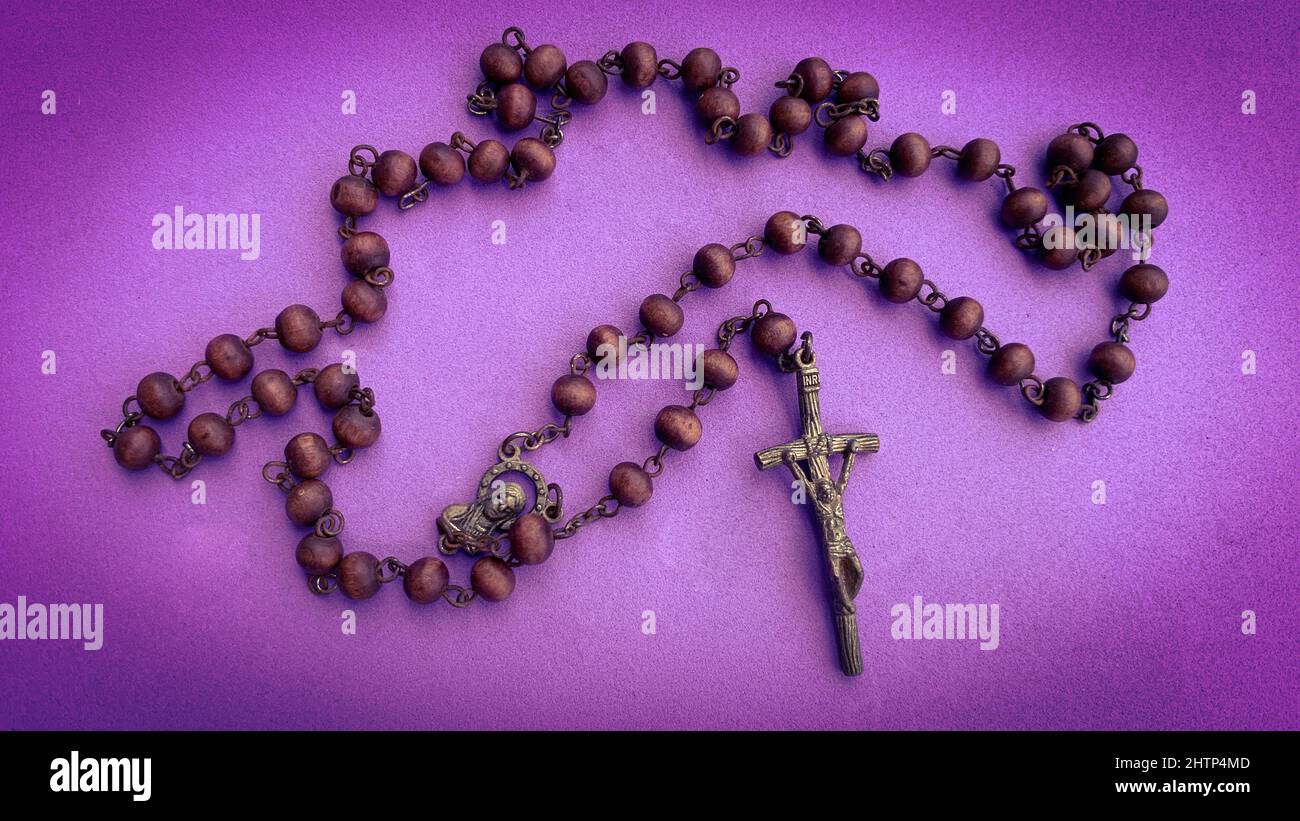 holy-rosary-on-purple-color-cover-christianity-concept-stock-photo-alamy