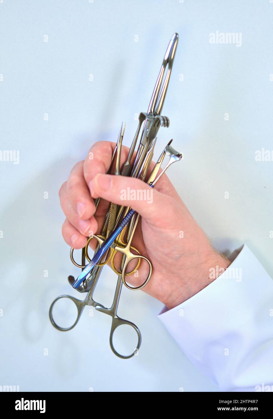 doctor holds surgical instruments in his hands Stock Photo - Alamy