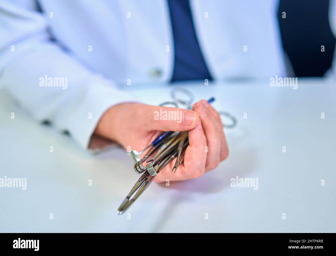 doctor holds surgical instruments in his hands Stock Photo - Alamy
