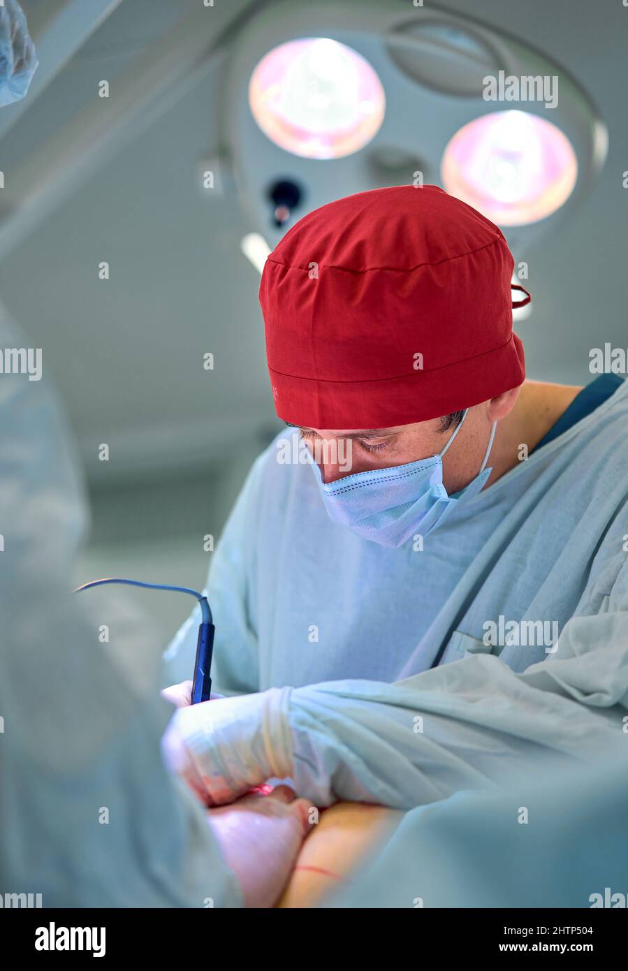surgeon in the operating room performs an operation on a patient Stock ...