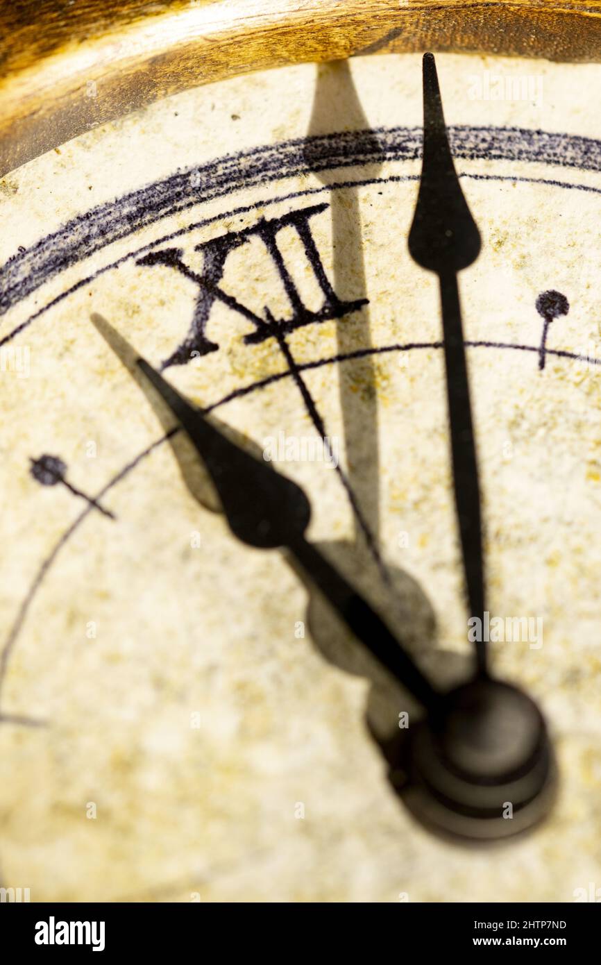 concept of exact time with hands of an ancient clock Stock Photo Alamy