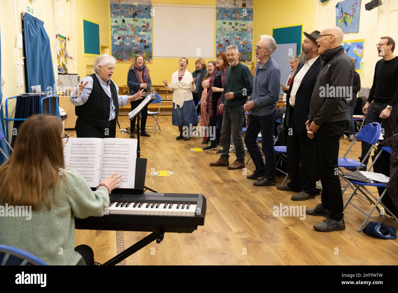 Brighton City Singers with choirmaster MJ Paranzino in Hove, East Sussex, UK Stock Photo
