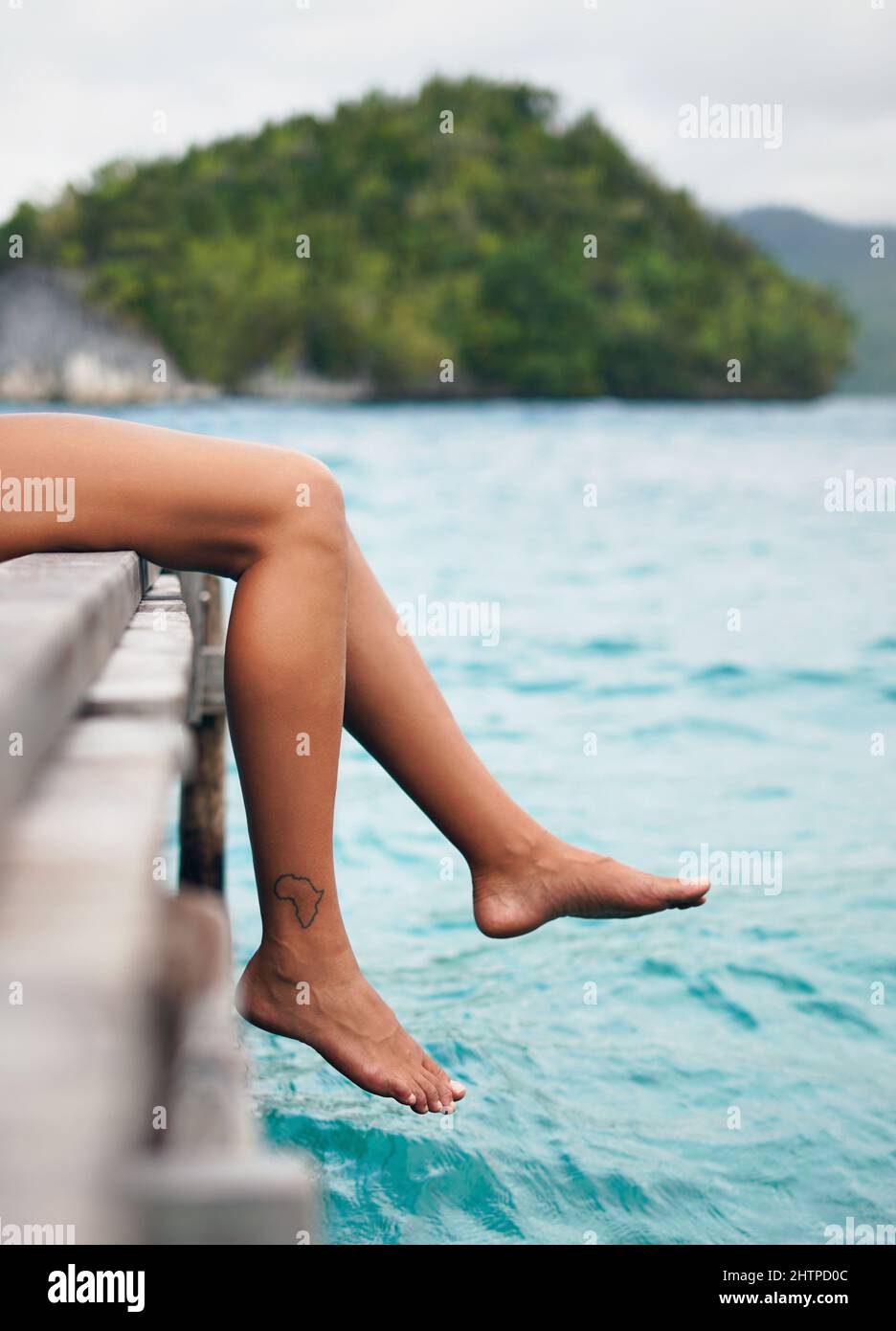 Women dangling legs hi res stock photography and images alamy