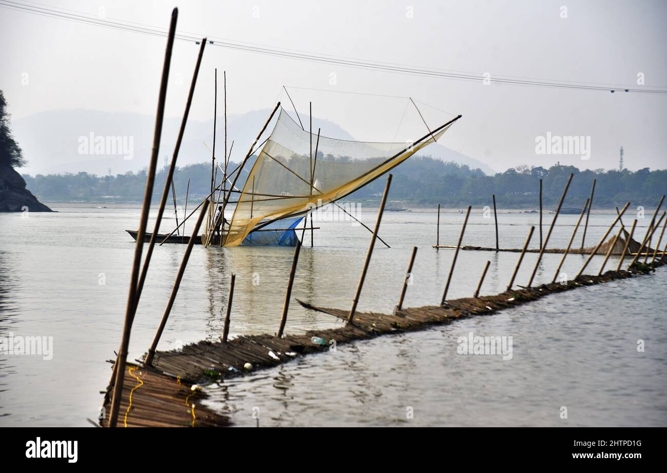 Guwahati, Guwahati, India. 1st Mar, 2022. Fisherman spread fishing net in river Brahamaputra to catch fishes in Guwahati Assam India on Tuesday 1st March 2022 (Credit Image: © Dasarath Deka/ZUMA Press Wire) Stock Photo