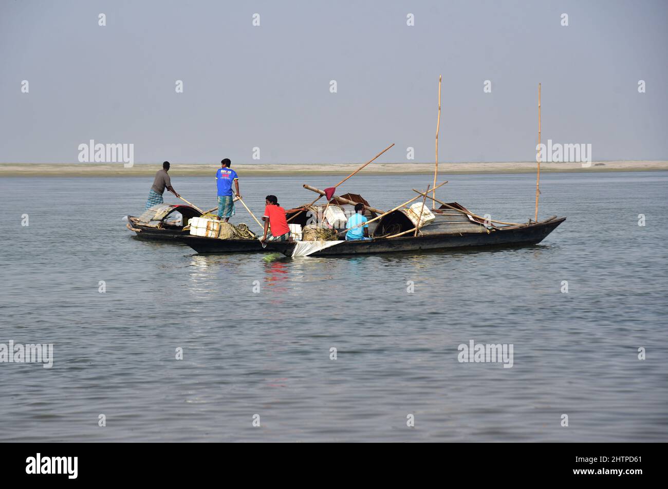 Guwahati, Guwahati, India. 1st Mar, 2022. Fishermen sit on their boat after catching fishes in river Brahamaputra in Guwahati Assam India on Tuesday 1st March 2022 (Credit Image: © Dasarath Deka/ZUMA Press Wire) Stock Photo