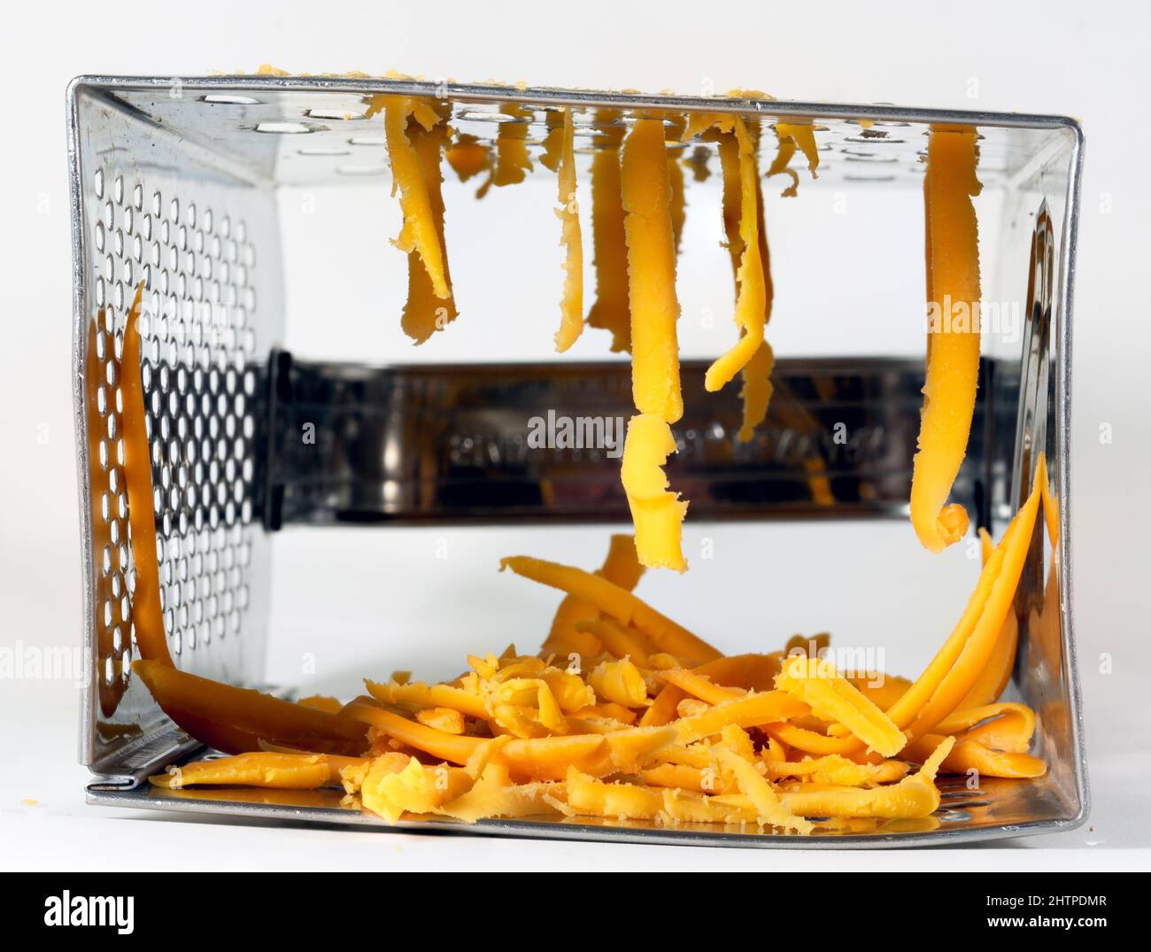 Cheese grater on a white background Stock Photo - Alamy