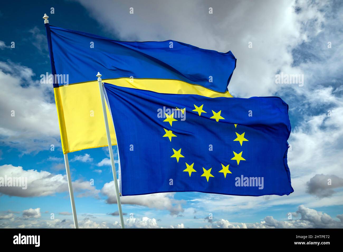 Ukrainian blue and yellow bicolor national flag on blue sky background. Ukraine fight for Freedom concept Stock Photo