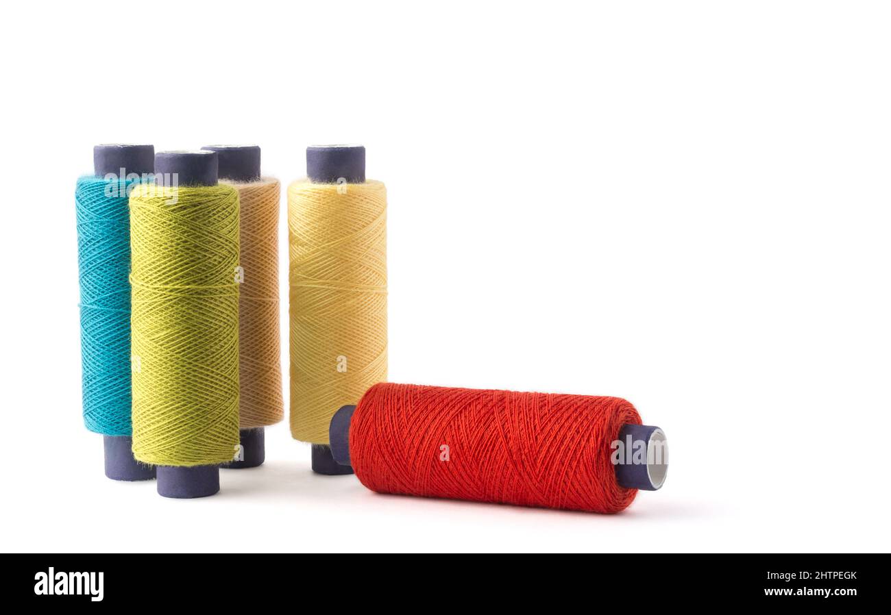 spool of sewing thread used in fabric and textile industry, different