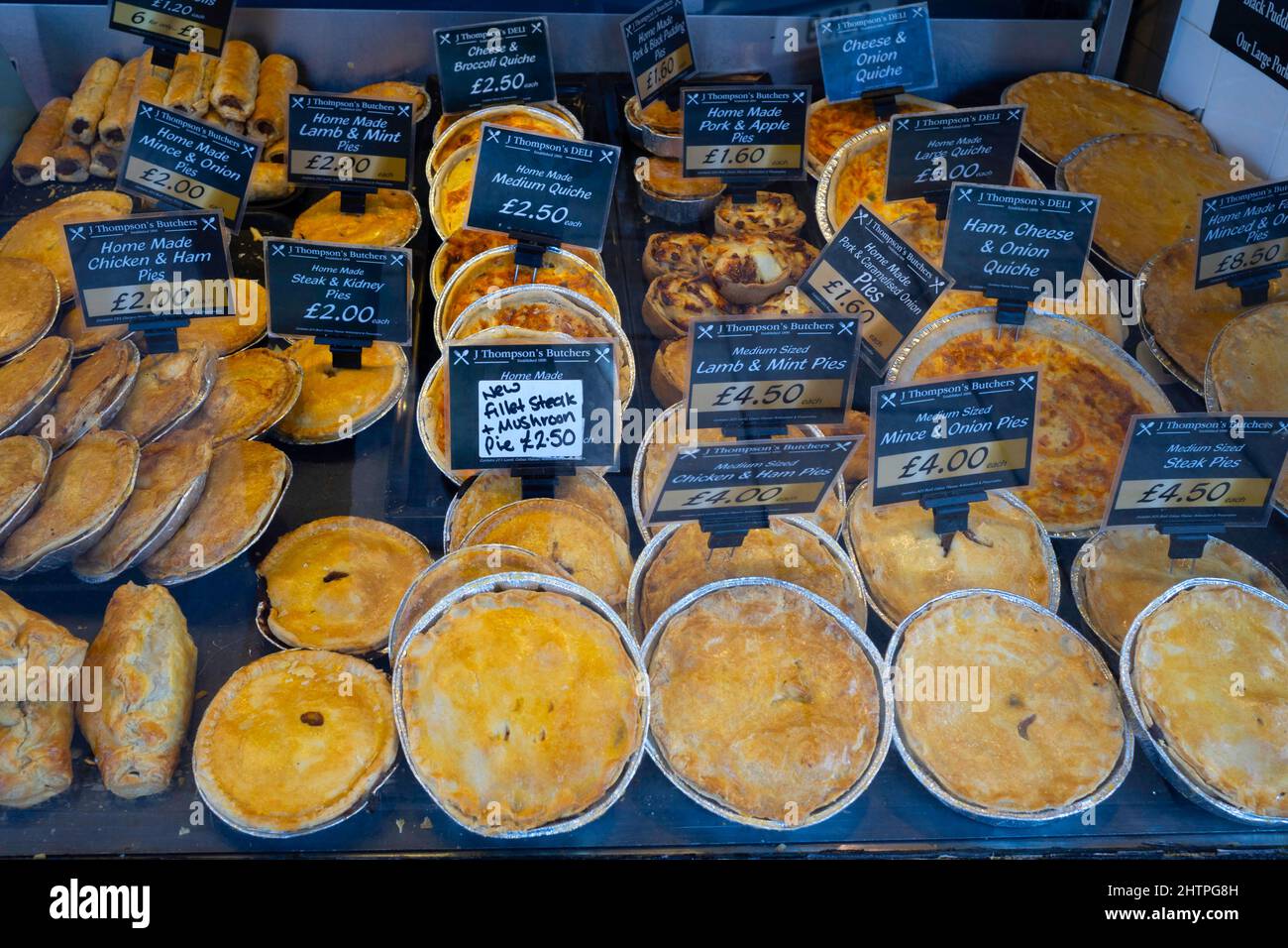 J Thompson's Butchers  shop window in Northallerton  with a display of various types of meat pies and pasties Stock Photo