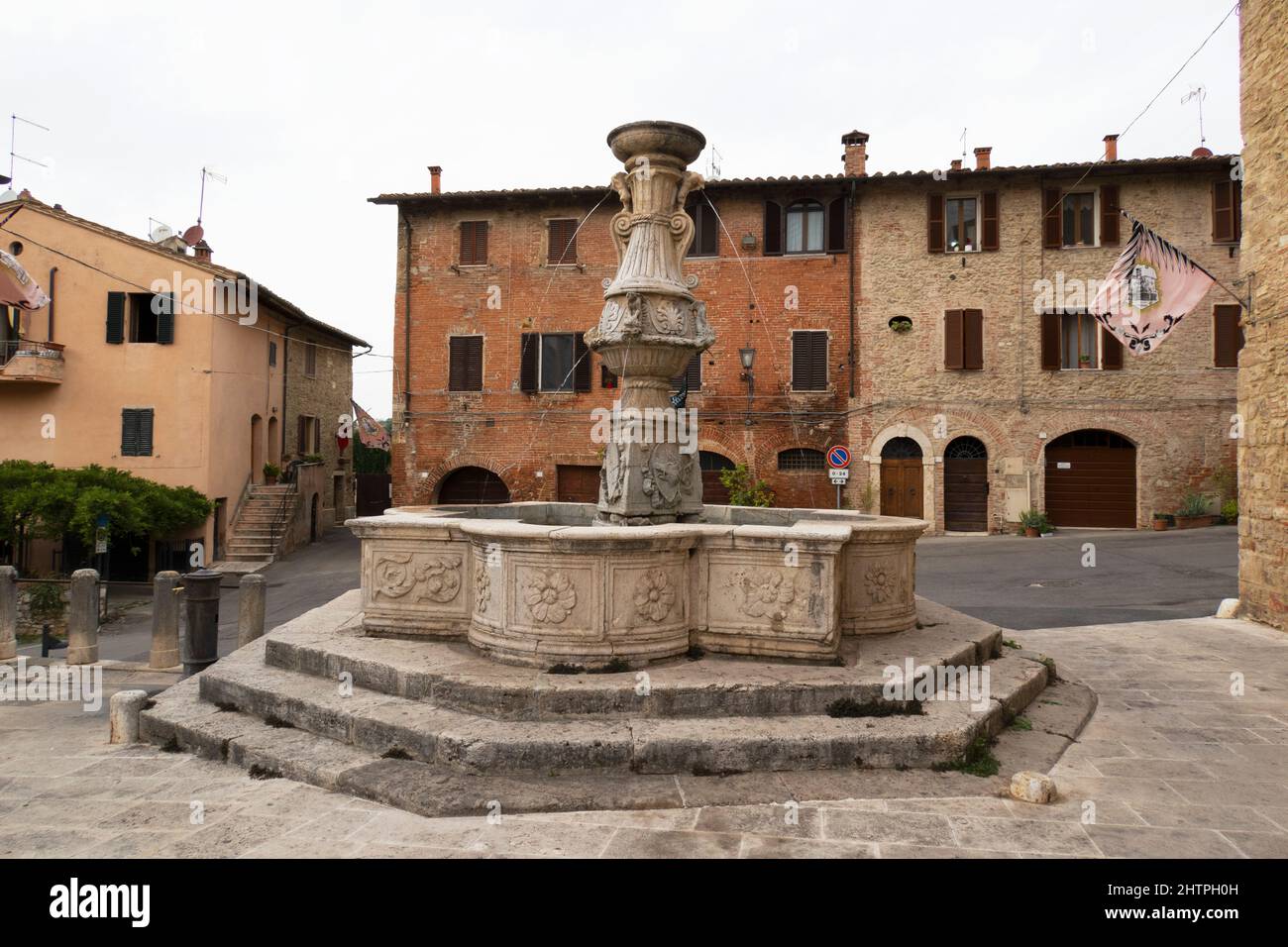 Ancient fountain of Piazza del Grano, Asciano village, Crete Senesi area, Siena province, Tuscany, Europe Stock Photo
