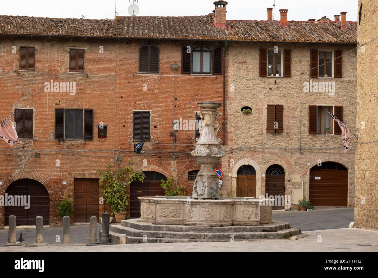 Ancient fountain of Piazza del Grano, Asciano village, Crete Senesi area, Siena province, Tuscany, Europe Stock Photo