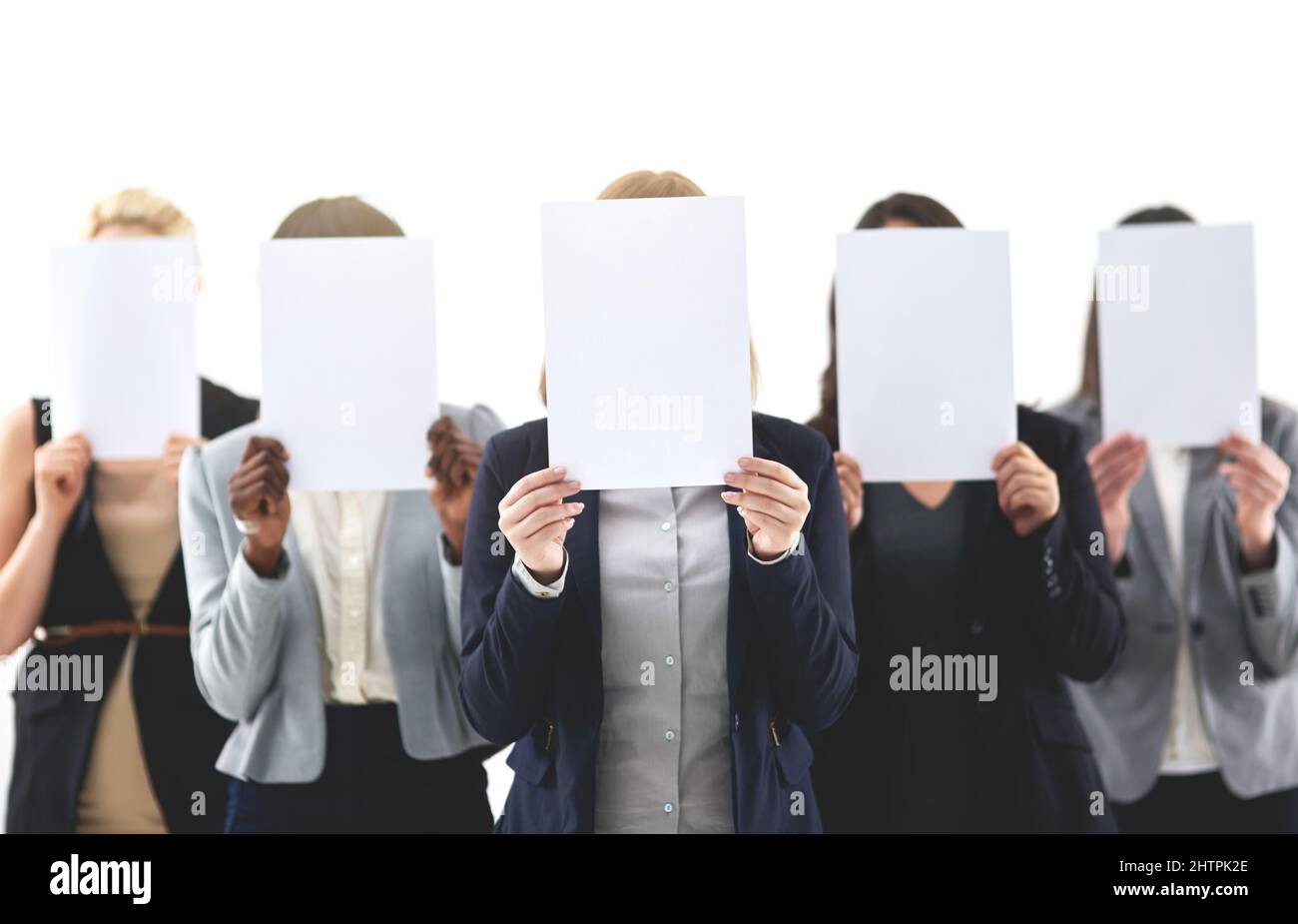We Have Something To Say Shot Of Businesspeople Each Holding A Blank we-have-something-to-say-shot-of-businesspeople-each-holding-a-blank