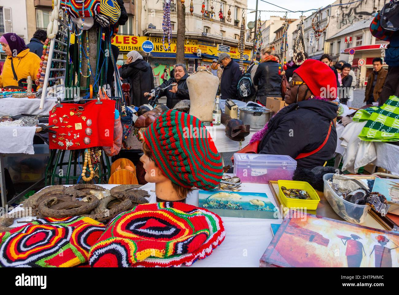 Paris, France, African Woman Selling Handmade Clothing Accessories on Street, Crowd People Shopping, Flea Market on Rue de Belleville, Paris street vendors, shopping tourism fashion Stock Photo