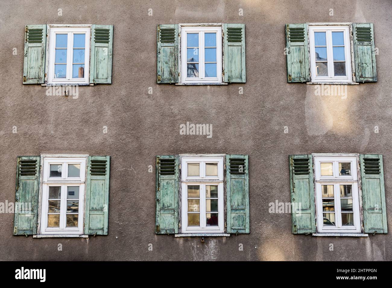 Old House Facade with green wooden folding shutters in detail Stock ...
