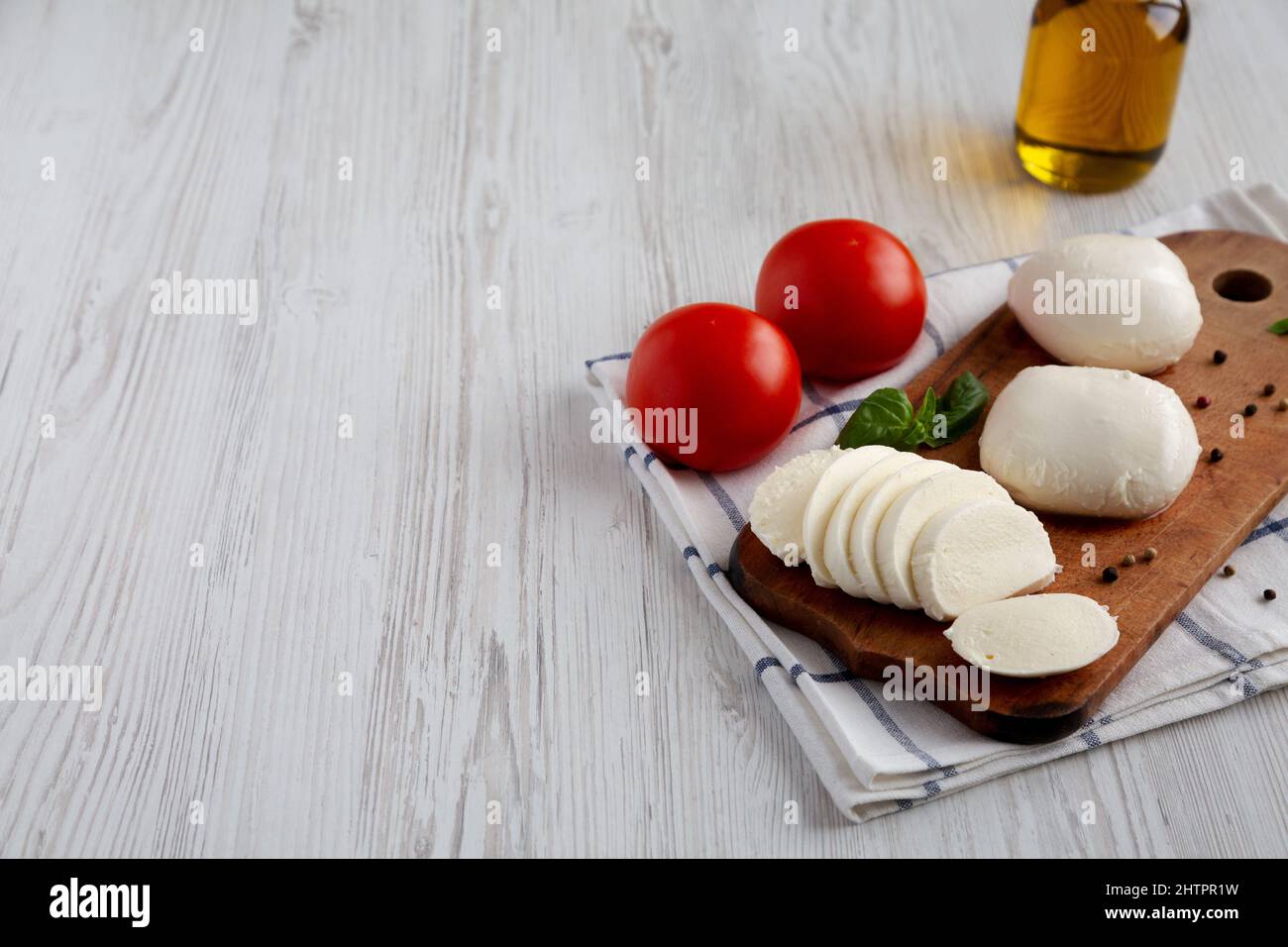 Homemade Mozzarella Cheese with Tomato, Basil and Olive Oil, low angle