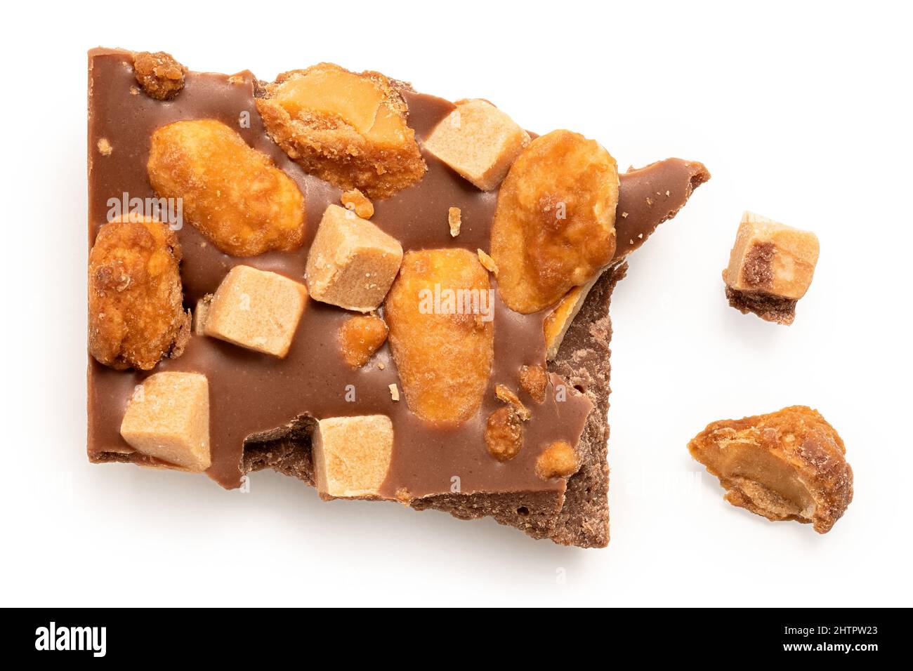 Broken milk salted peanut and caramel chocolate isolated on white.Top view. Stock Photo