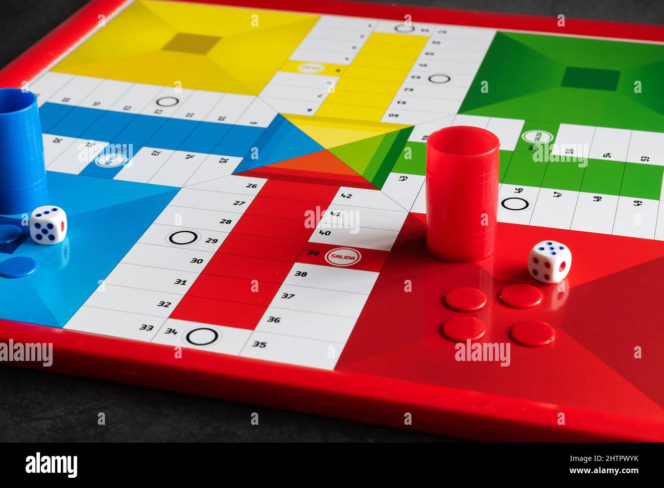 Classic Parcheesi game board with tokens and dice Stock Photo Alamy