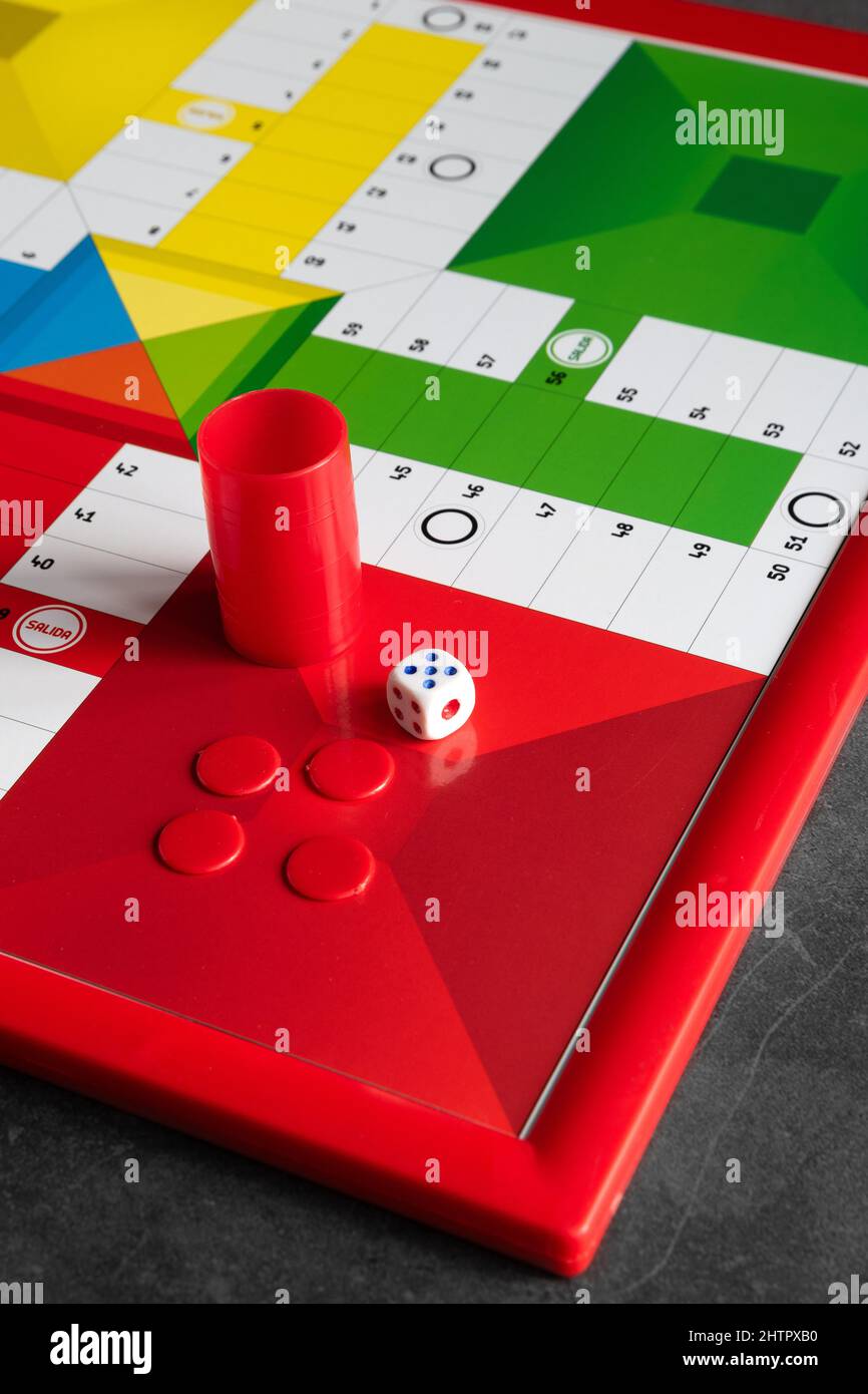 Classic Parcheesi game board with tokens and dice Stock Photo Alamy