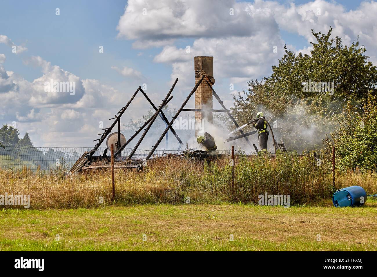 July 23, 2021, Dole island, Latvia: extinguishing the fire destroyed the village house Stock Photo