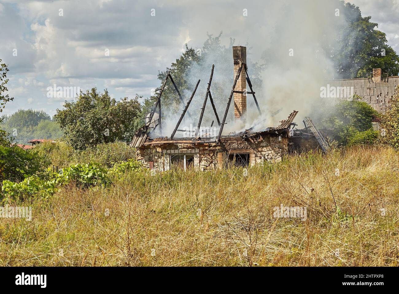 July 23, 2021, Dole island, Latvia: extinguishing the fire destroyed the village house Stock Photo