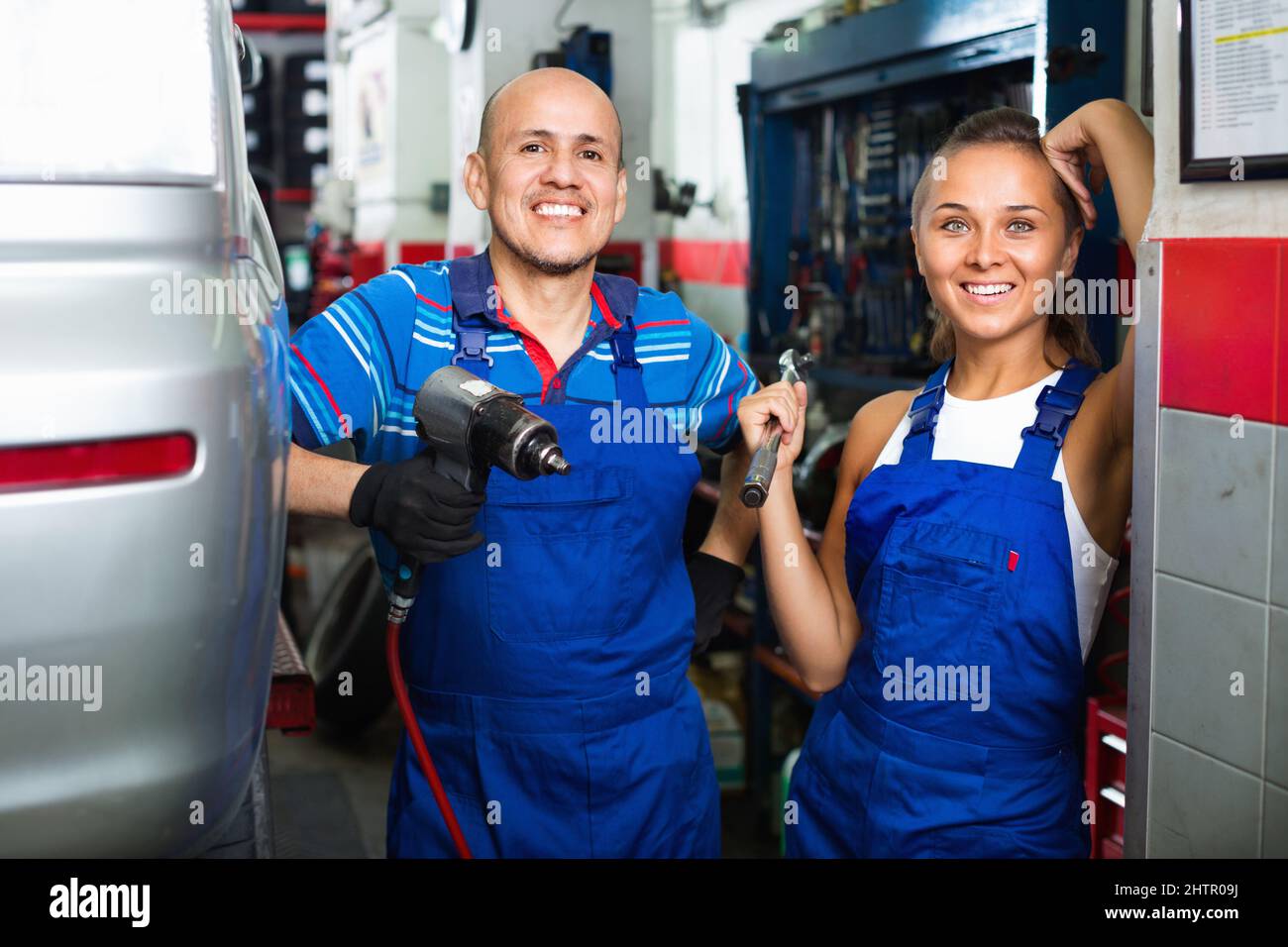 Portrait of two workers in protective overalls Stock Photo