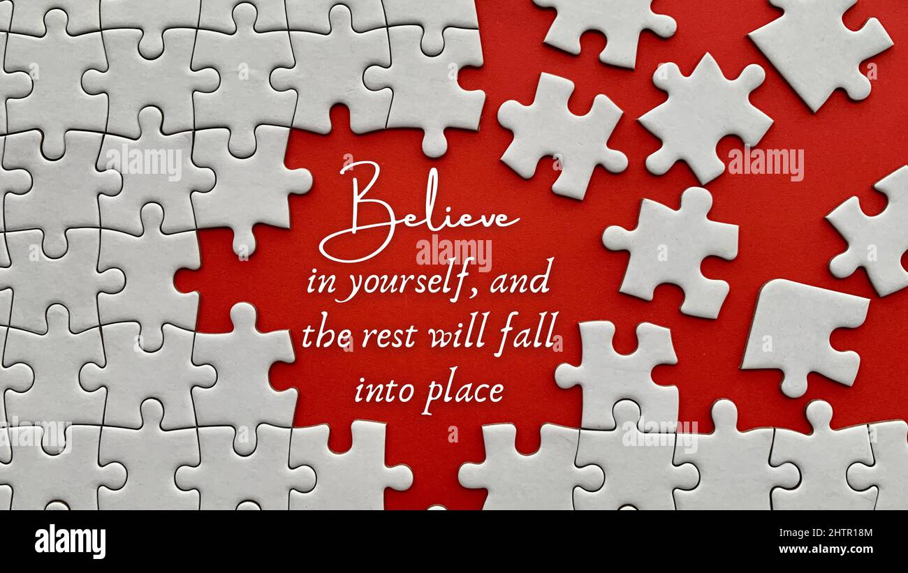 Top view of motivational quote on red cover Believe in yourself, and the rest will fall into