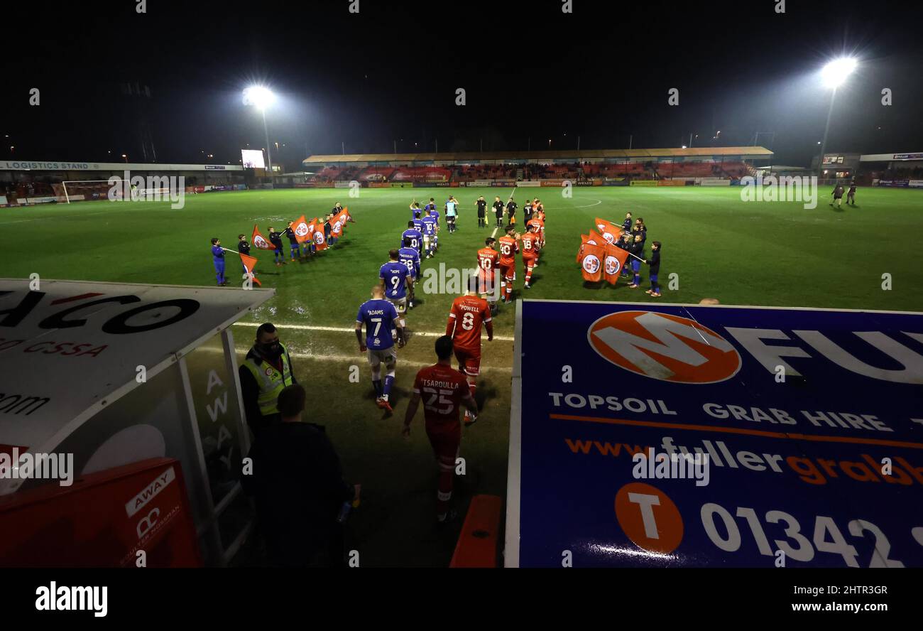 Players walk out of the tunnel onto the pitch for the EFL League Two match between Crawley Town and Oldham Athletic at The People’s Pension Stadium. 1st March 2022 Stock Photo