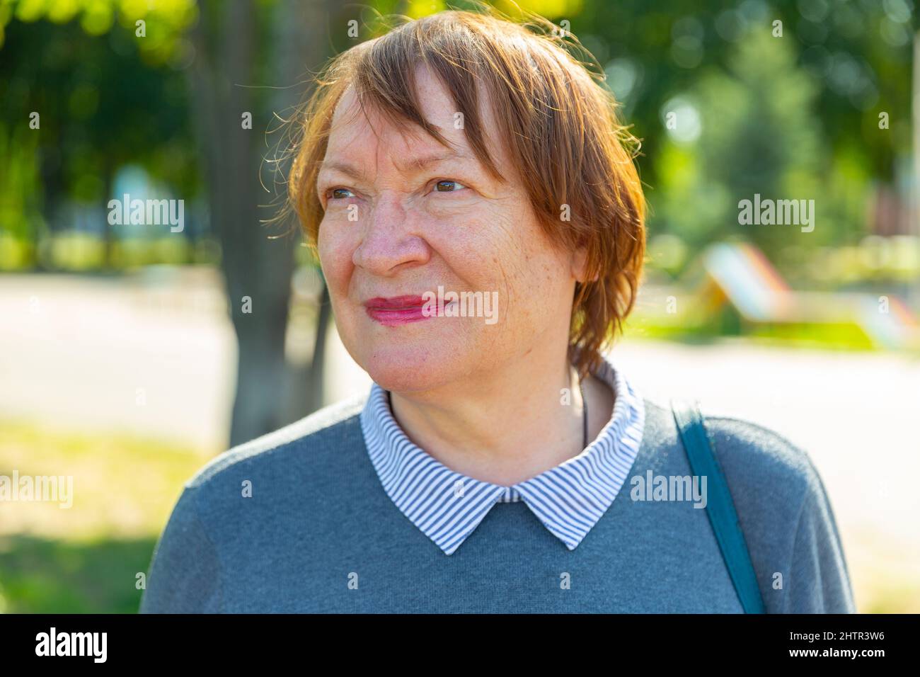 Portrait of a smiling mature woman Stock Photo - Alamy
