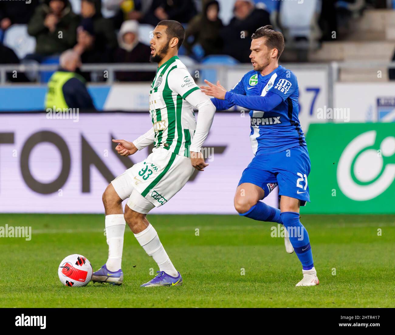 BUDAPEST, HUNGARY - MARCH 6: Lazar Zlicic of Kisvarda Master Good  challenges Aissa Laidouni of Ferencvarosi TC during the Hungarian OTP Bank  Liga match between Ferencvarosi TC and Kisvarda Master Good at