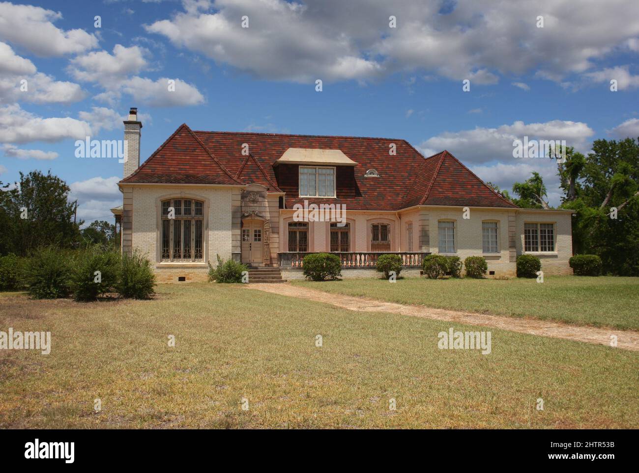 Abandoned Historic Brick House With Blue Sky and Clouds Stock Photo - Alamy