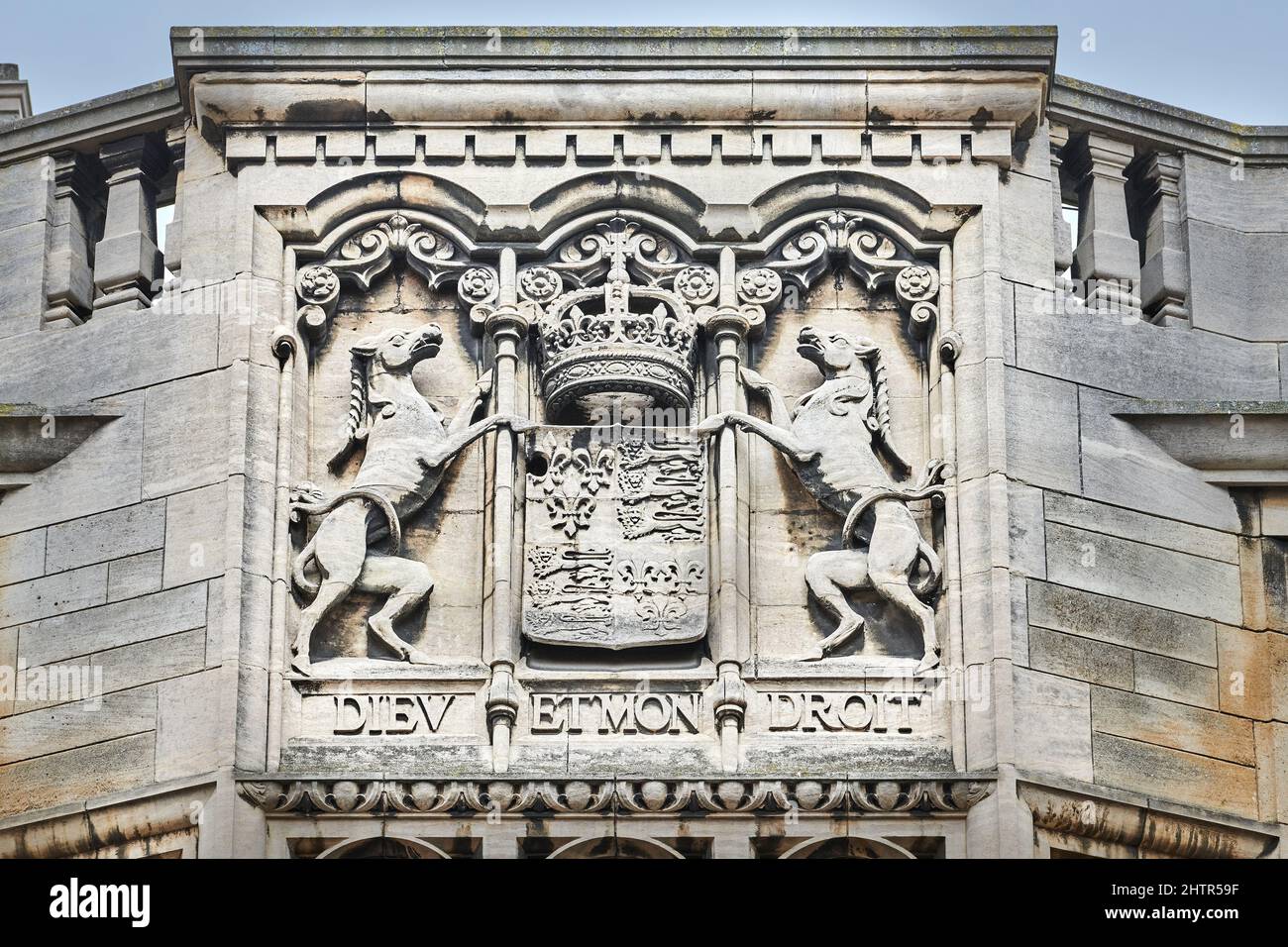 Stone sculpted royal coat of arms on an outside wall of King's college, university of Cambridge, England. Stock Photo