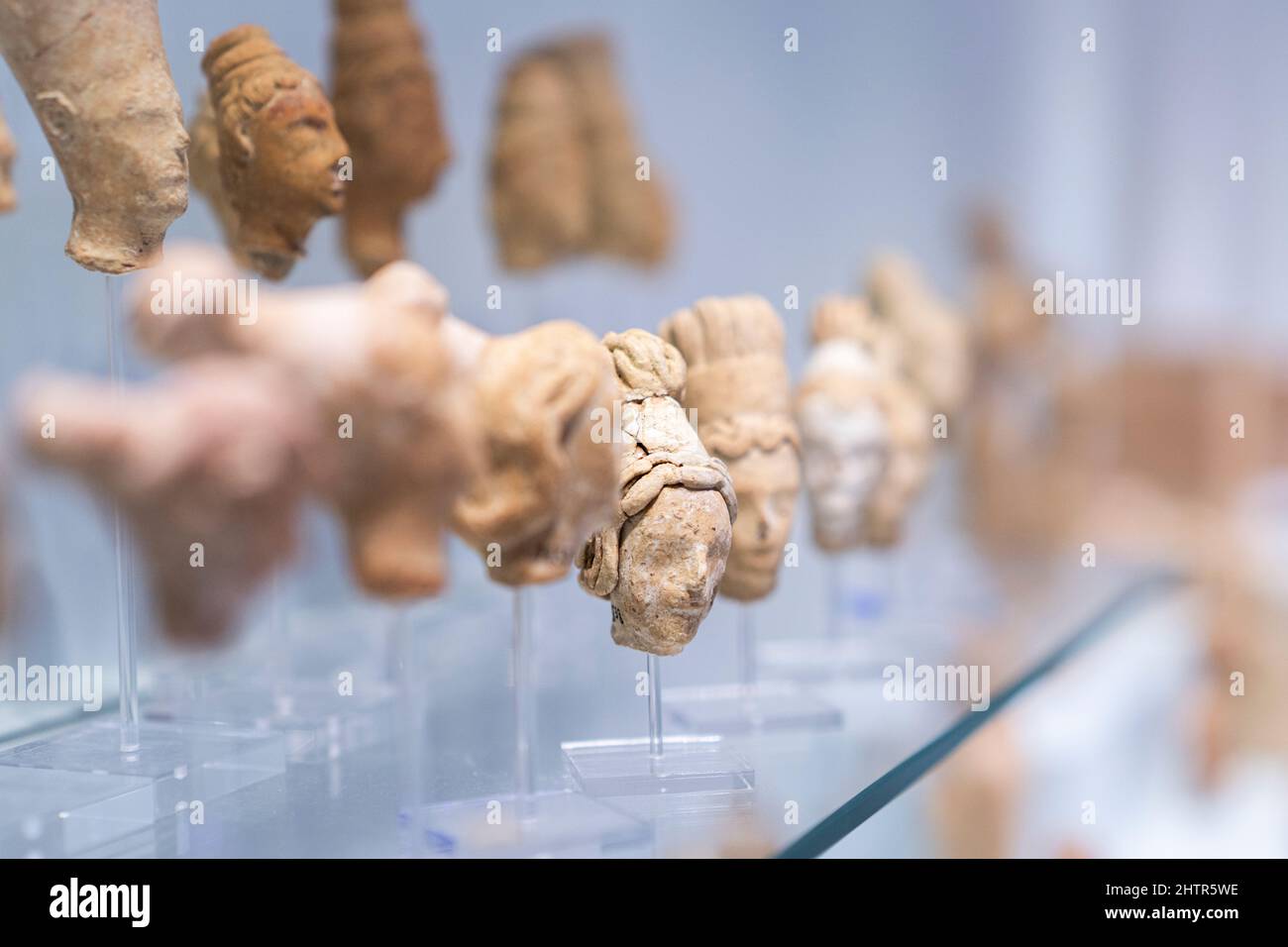 Clay figurines of human heads of philosophers and goddess,  Archaeological Museum of Heraklion, Crete, Greece Stock Photo