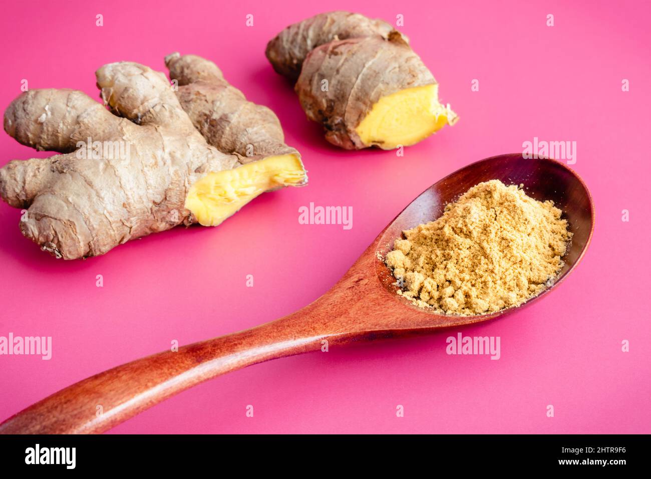 Ground Ginger with Fresh Ginger Root A spoonful of ground ginger with