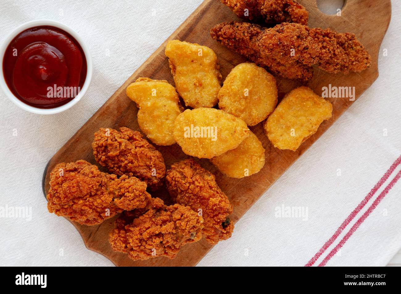 Tasty Fastfood Chicken Nuggets, Wings and Tenders with ketchup, top