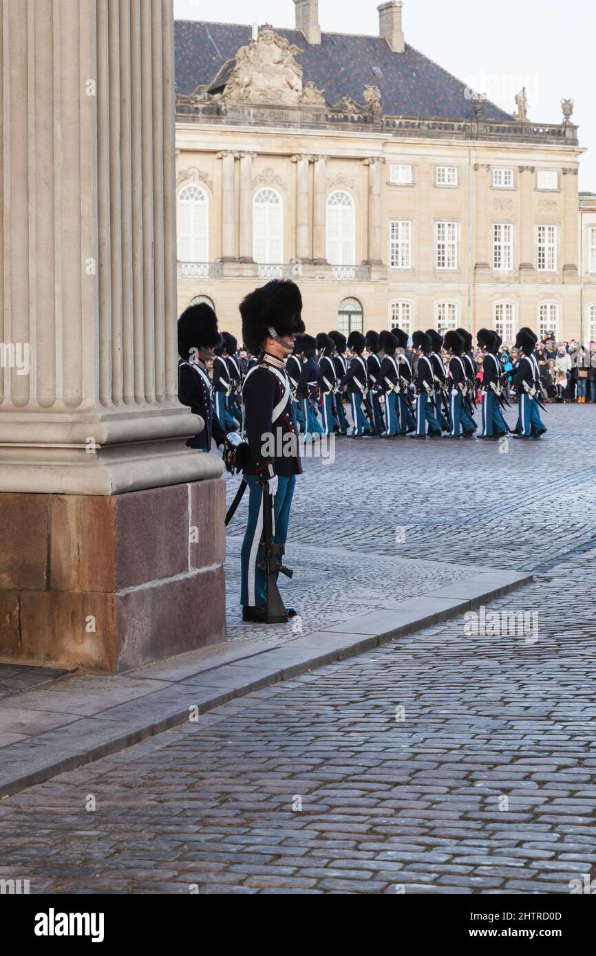 Copenhagen, Denmark - December 9, 2017: Royal guardsmen at the royal palace Amalienborg. The ceremony of changing the guard of honor, vertical photo Stock Photo