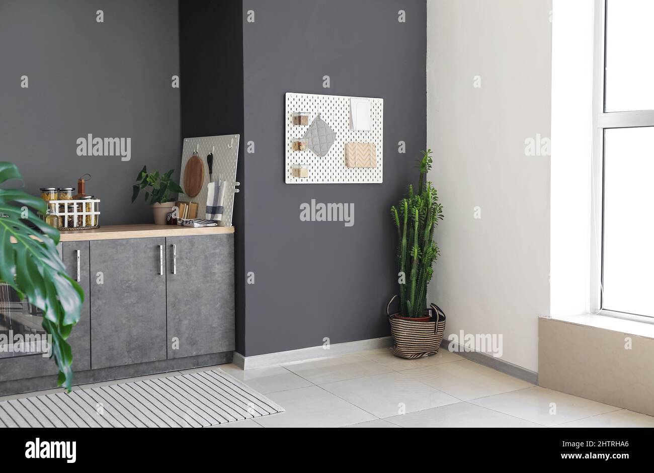 Interior of contemporary kitchen with modern furniture and pegboard ...