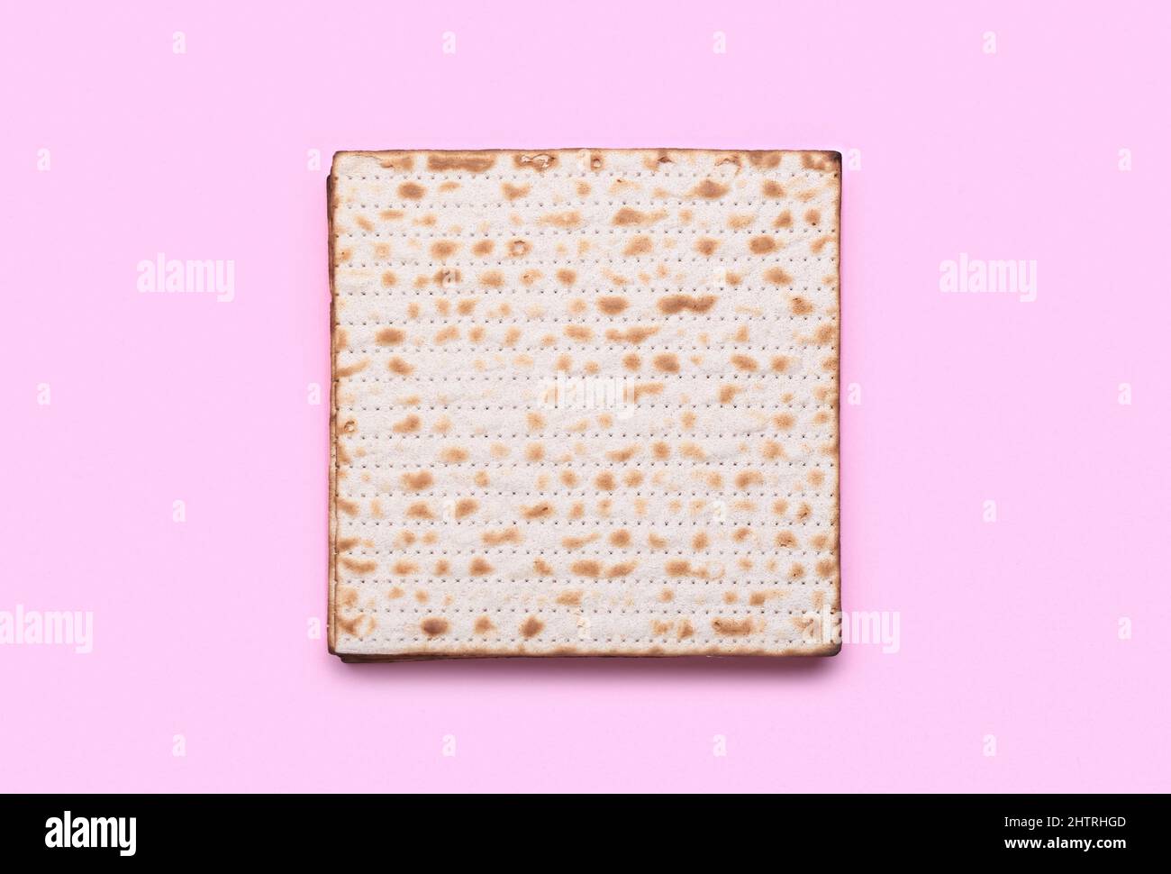 Jewish flatbread matza for Passover on pink background Stock Photo Alamy