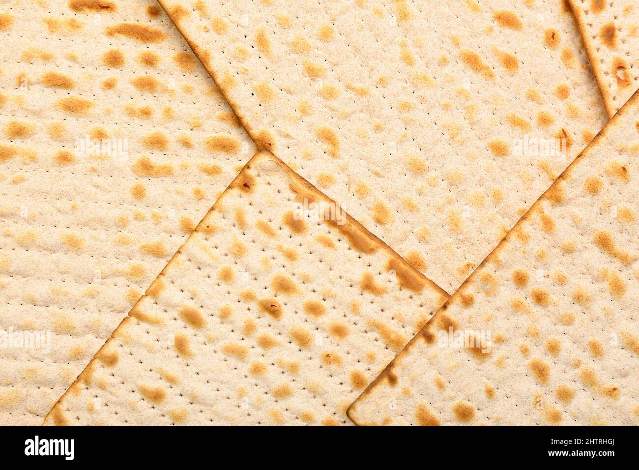 Traditional Jewish flatbread matza for Passover as background, closeup Stock Photo Alamy